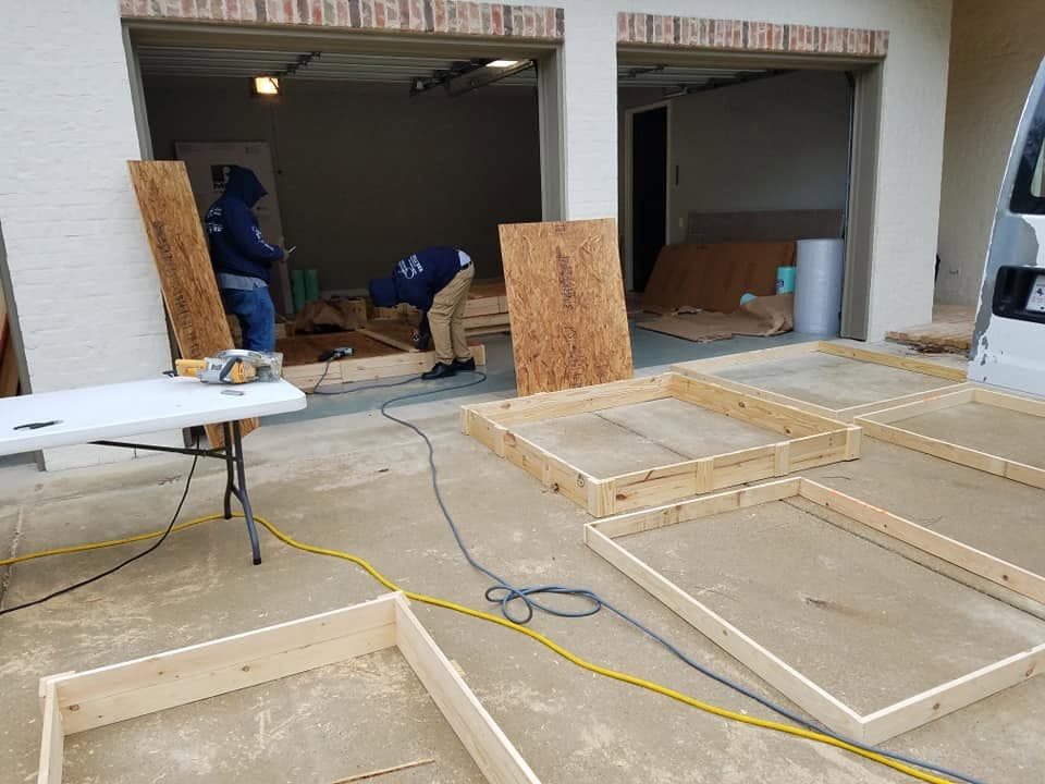 The crew building crates on site in a customer's driveway