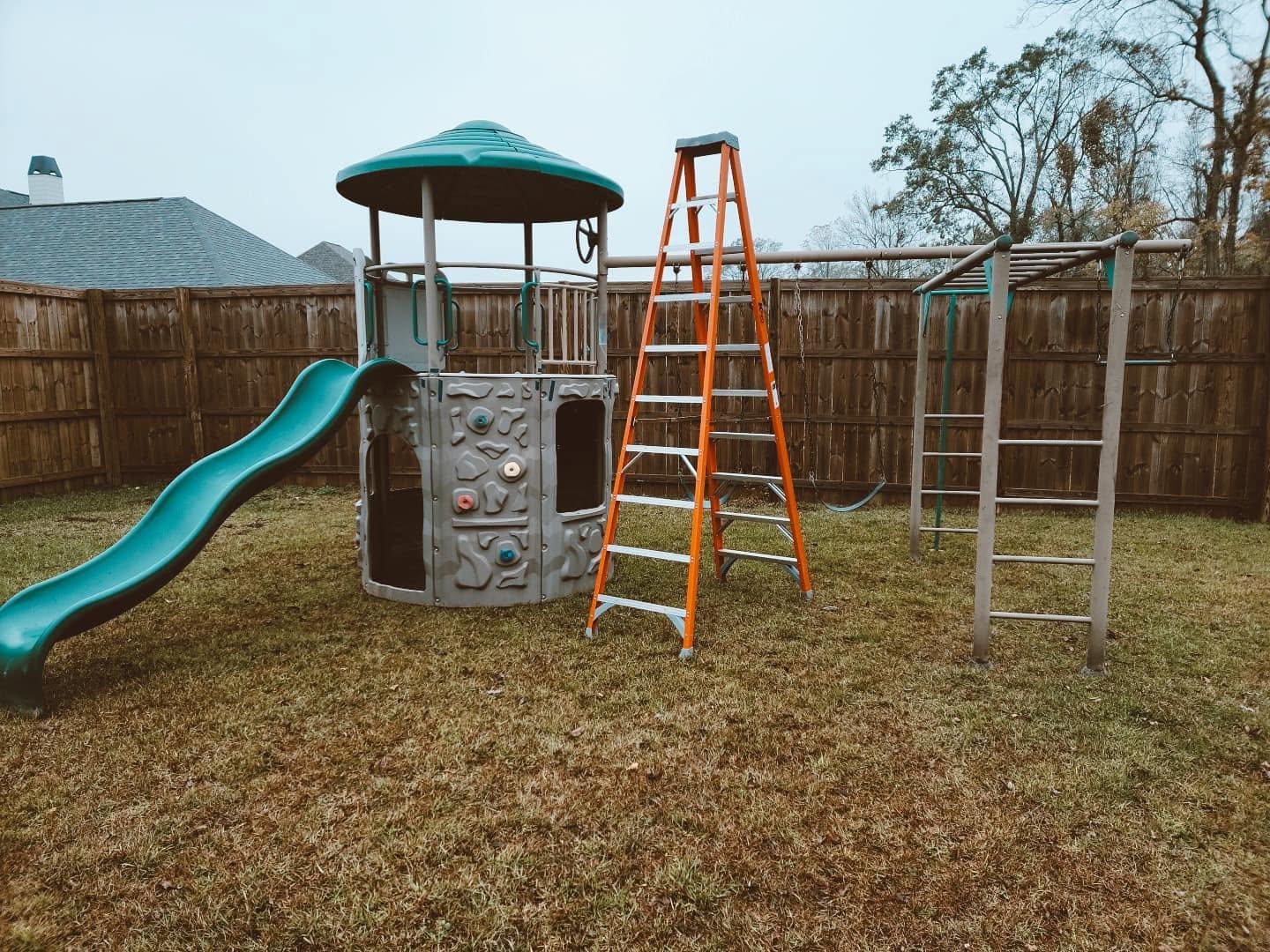 An assembled playset with a covered lookout and slide